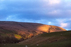 Sunset reflected off a hillside in the dales