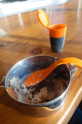 A breakfast of porridge with a spork from a camping pan