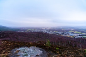 A view back down over Aviemore in the rain