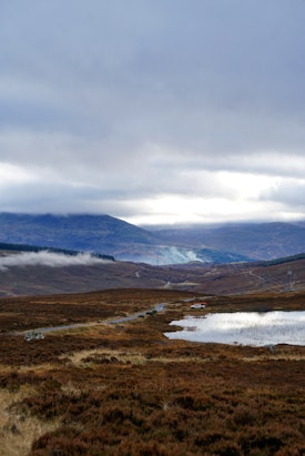 A view over the hills with a small loch near Pitlochry