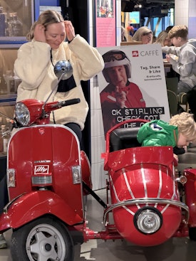 Jack and H in a motorbike with a sidecar in The St James Center